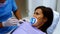 Dentist interacting with female patient