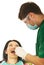 Dentist male working with patient woman