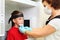 Dentist in mask prepares boy to jaw x-ray image