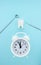 Dentist office tools for teeth care, tooth model molar and white alarmclock at blue background, top view, close up. Teeth care and