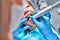 Dentist performing dental filling procedure to preteen girl in pediatric dental clinic