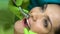 Dentist polishing central incisor, preparing tooth for sealant placement closeup