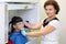 Dentist prepares boy wearing in protective lead