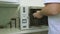 Dentist pulls out sterilization cabinet Instruments