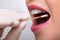 Dentist`s Hand Taking Saliva Test From Woman`s Mouth