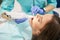 Dentist scanning female teeth with dental 3D scanner
