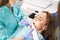 Dentist scanning woman teeth with dental 3D scanner