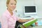 Dentist sits at table in dental clinic