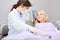 Dentist with surgical mask and child as a patient