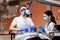 A dentist treats a woman`s teeth using a cofferdam. Dental equipment