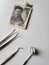 dentist utensils for oral review and japanese banknote of 1000 yen