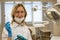 Dentist woman with tools over medical clinic background