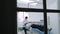 Dentist at work view, camera tracking from the dental office to a window.
