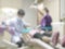 Dentistry blur background with dentist working on curing child patient who visiting dental clinic office, having teeth checkup