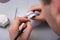 Denture layout. The technician applies a special coating on the dental layout. Dental laboratory, implantation