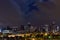 Denver Colorado downtown skyline at night with clouds overhead