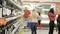 A department of alcohol in the supermarket. Shelves full of bottles People on a blurry background. Shopping and people