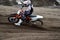 Departure with acceleration out of turn motocross