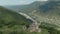 Departure on a drone from the ancient dilapidated Christian church standing high on the mountain. Aerial View. North