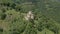 Departure on the dune around the ancient dilapidated Christian church standing high on the mountain. Erial View. North