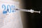 Depicting a Medical Vaccine Syringe used as a Dart on the 2021 Calander