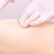 Depilation spa procedure. Woman hair remove waxing. Epilation sugaring. Legs foot