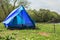 Deployed tent stands on river bank