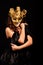 Depraved woman in golden half mask