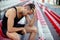 Depressed athlete man sitting head in hands on stadium seats