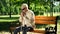 Depressed blind man sitting alone in park, socially disadvantaged population