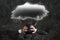 Depressed businessman with dark cloud rain lightning over his he
