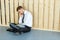 Depressed Businessman sitting on floor at his office. Hard work