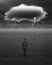 Depressed businessman walking with dark cloud of rain and lightning