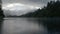 Depressed cloudscape and strong rain over the Lake Matheson