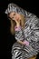 Depressed expression on a woman\'s face wearing cat pajamas