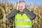 Depressed farmer at outdoor on cold corn field