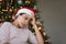 Depressed frustrated Indian girl in Christmas hat going through problems