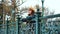 Depressed girl standing on bridge in park