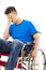 Depressed and handicapped man sitting on a wheelchair