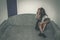 Depressed and lonely girl abused as young sitting alone in her room on the bed feeling miserable and anxiety cry over her life, da