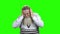 Depressed old man on green screen.