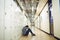 Depressed student sitting in locker room