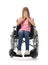 Depressed teenage girl in wheelchair on white background