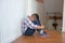 depressed upset sad asian kid boy child children sitting on floor