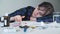 Depressed Woman beside a Lot of Pills on a Table