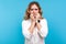 Depression and anxiety. Portrait of worried woman biting nails looking frightened terrified about problems. blue background