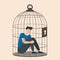 Depression and despair, young male character sitting inside a birdcage. Isolated character. Family problems, pressure at work