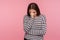 Depression, desperate emotions. Portrait of unhappy sad woman in striped sweatshirt standing with bowed head