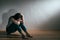 Depression sadness woman sitting on wooden floor