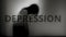 Depression text and dark sad silhouette.